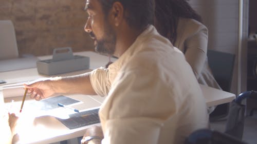 A Man Explaining in the Office