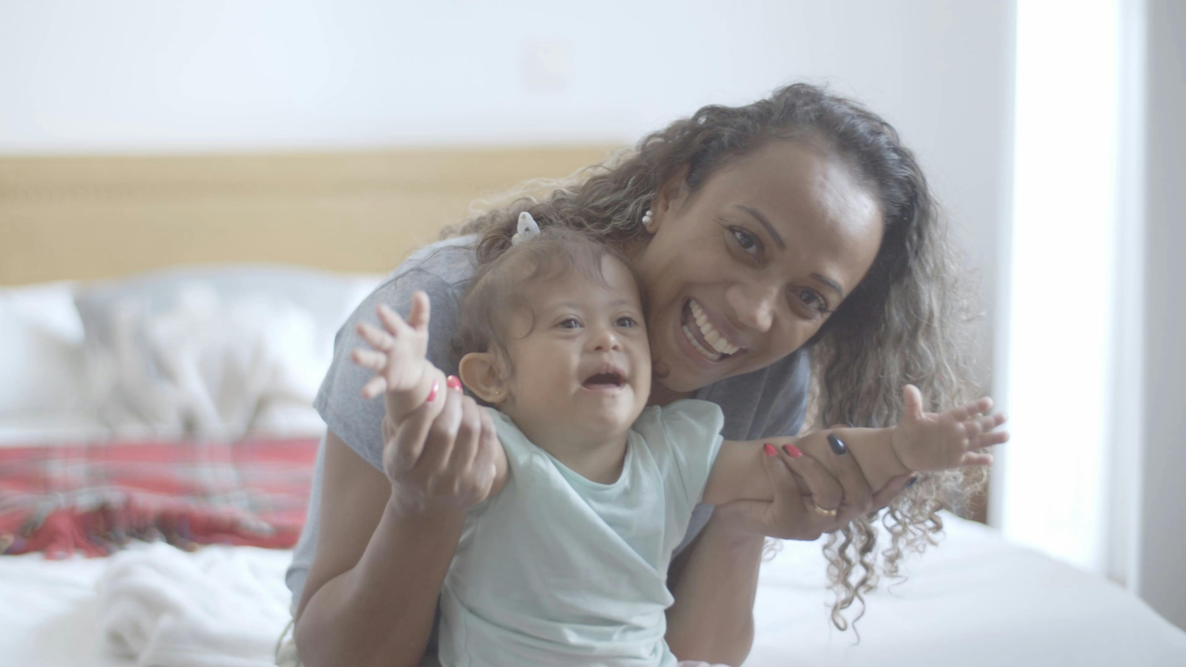 A Woman and Her Baby Looking at the Camera · Free Stock Video