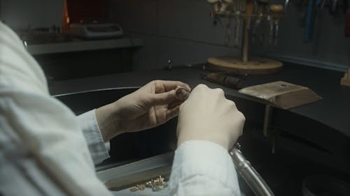 Close Up Shot of a Woman Making Jewelry