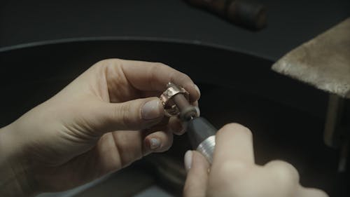 Close Up Shot of a Person Making Jewelry