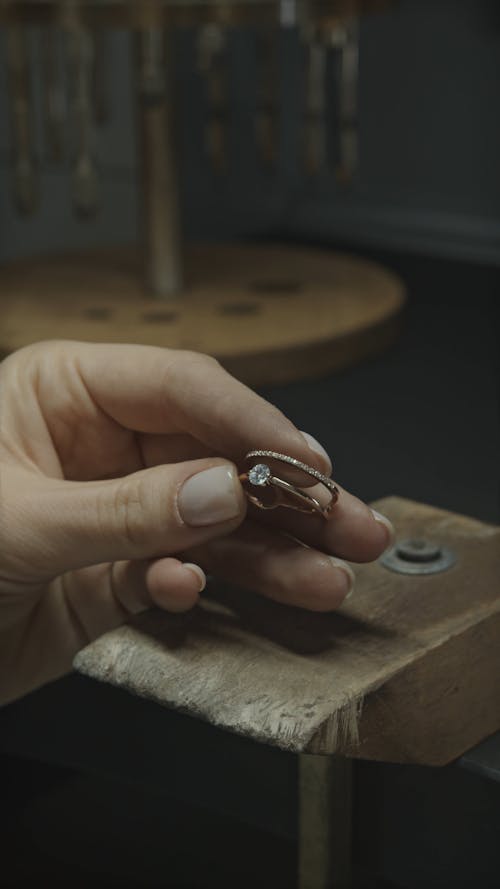 Close Up Shop of a Woman Making Jewelry