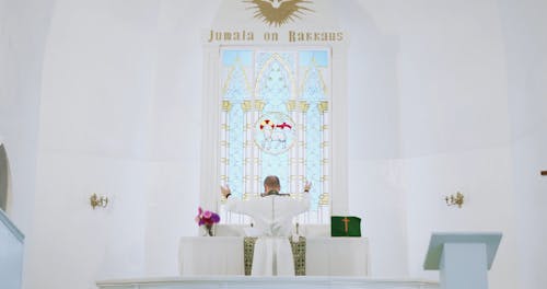 A Pastor Praying on the Altar