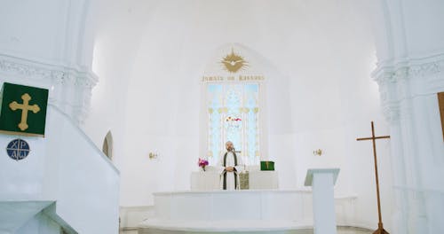 A Man Standing on the Altar Preaching