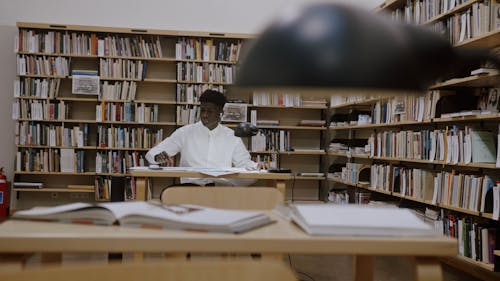 Man Sitting in a Library