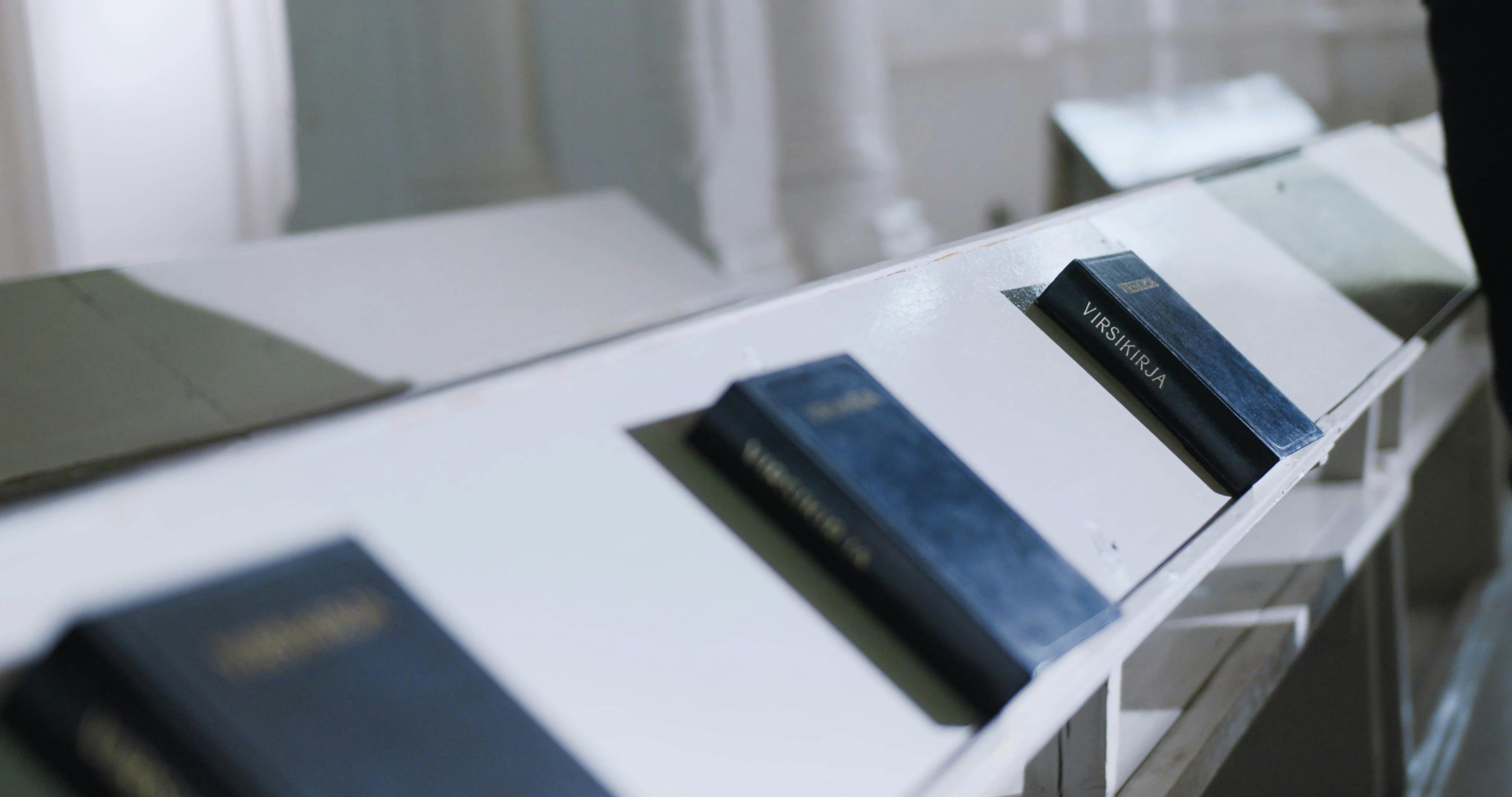 A Person Collecting Bibles in the Pews · Free Stock Video