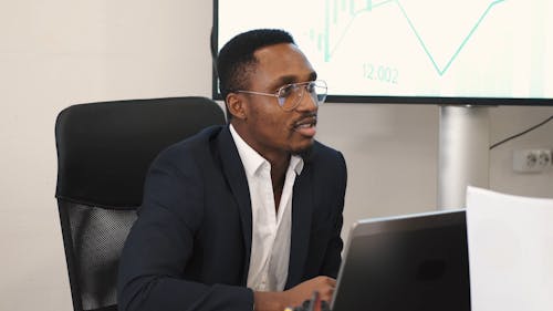 Young Businessman Working in Office