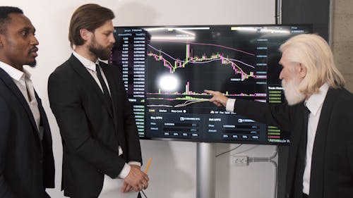 Businessmen Looking to a Chart