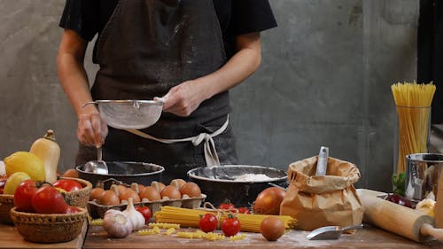 Person Sifting Flour