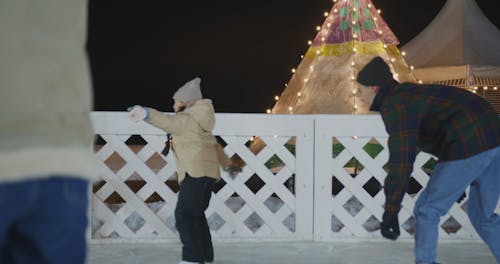 People Having Fun While Skating on Ice