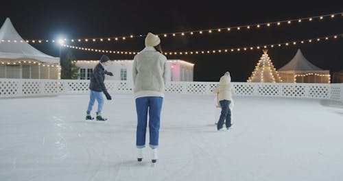 A Family Enjoying Ice Skating Together at Ice Skating Rink