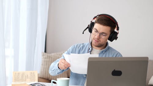 Person With Headphone In Front of Computer