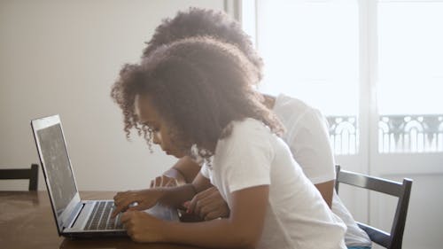 Little Girl Using A laptop