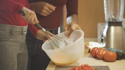 A Person Whisking an Egg
