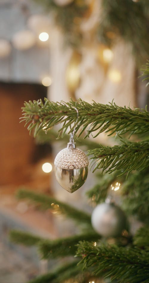 An Acorn Decoration Hanging on a Christmas Tree