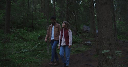 Young Couple Walking in Forest
