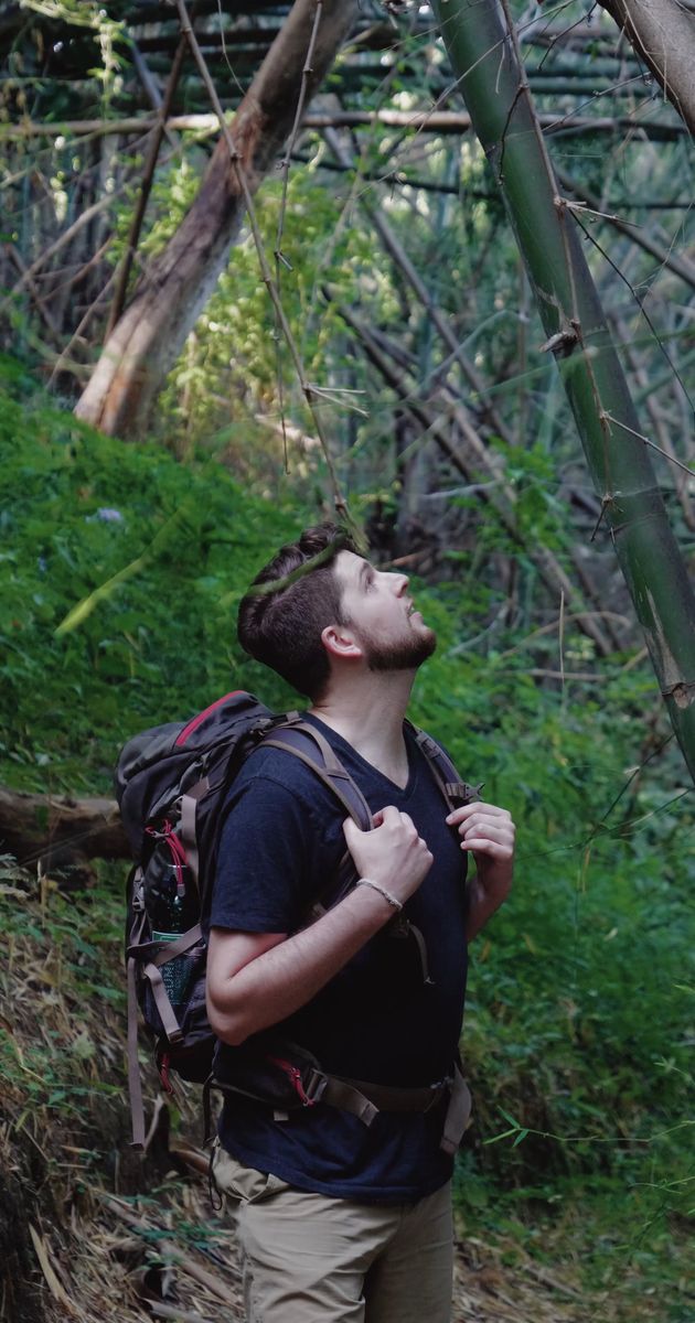 a tourist man enjoying looking around the nature 6318874