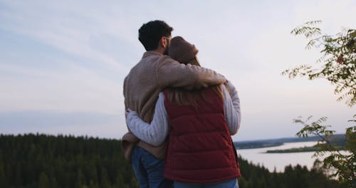 Couple Admiring Scenic View While Hugging
