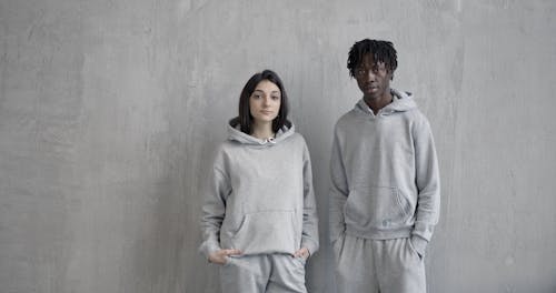 Female and Male Models in Gray Sweatshirt