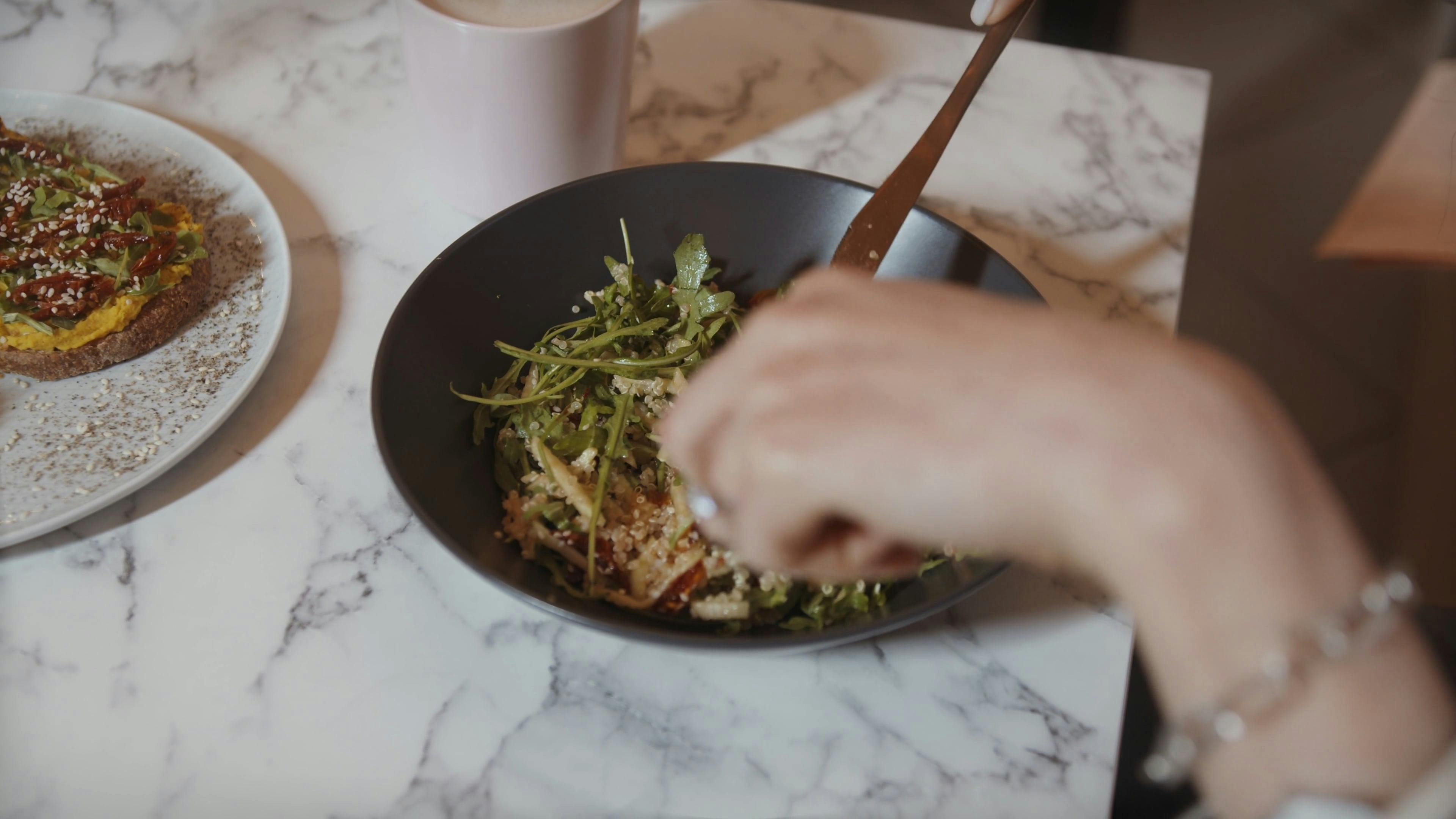 Cutting and Eating the Food using Bread Knife and Fork · Free Stock Video