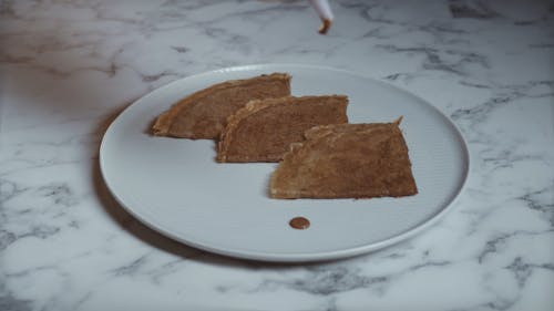 Person Decorating Pancake