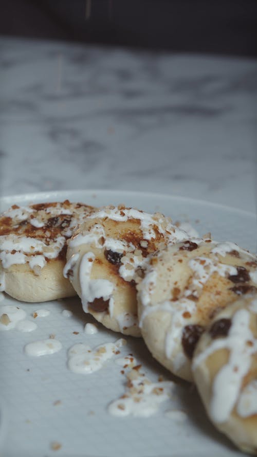 Person Decorating Dough Balls