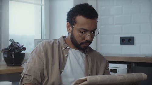 Man Reading Newspaper