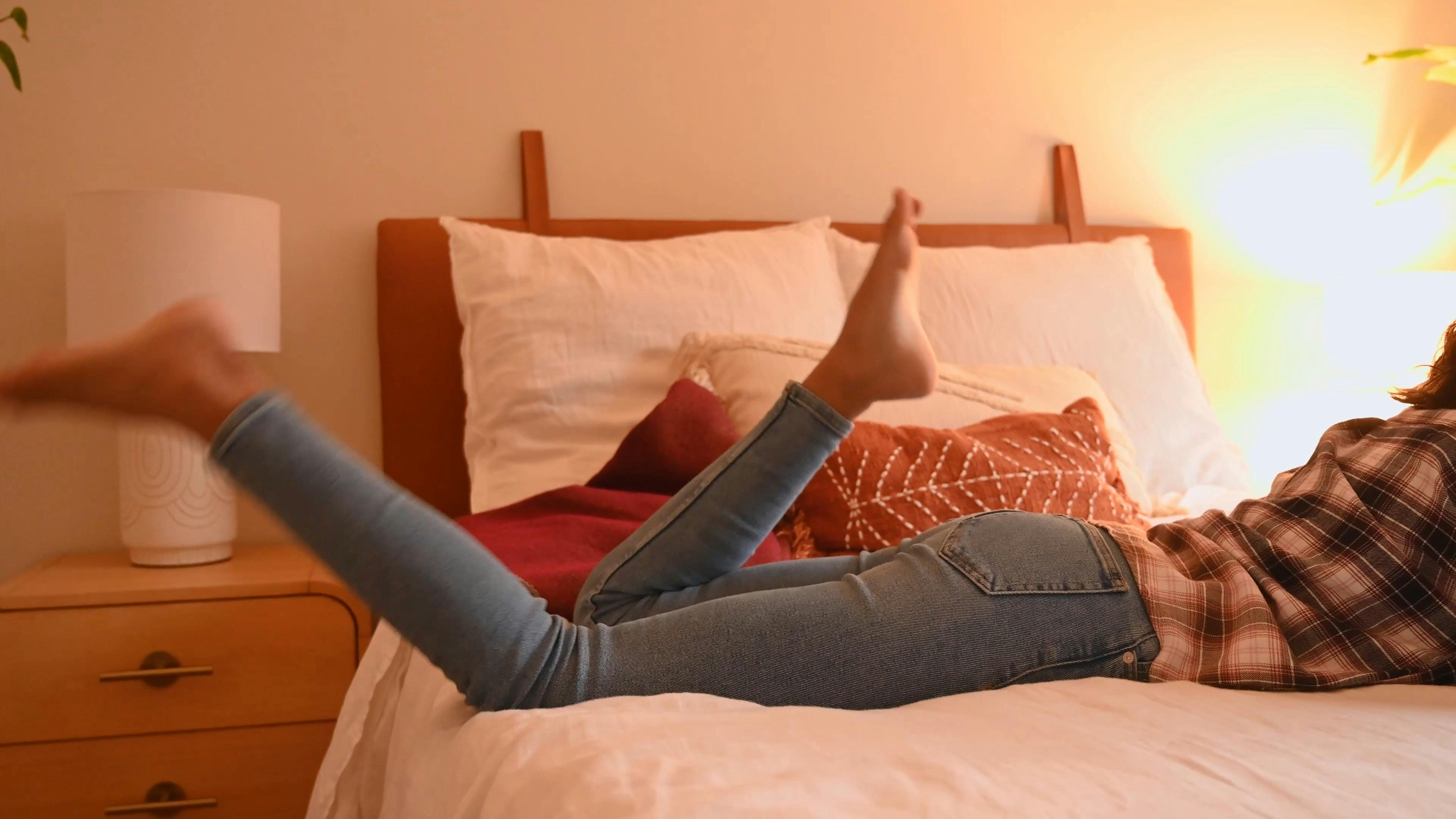 Woman Moving her Legs Playfully while Lying Down · Free Stock Video