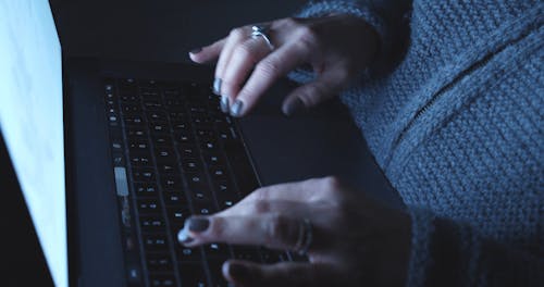 Close Up of Hands Typing on Laptop