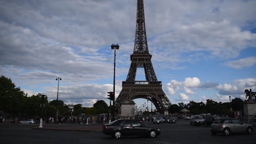 People and Cars in front of Eiffel Tower