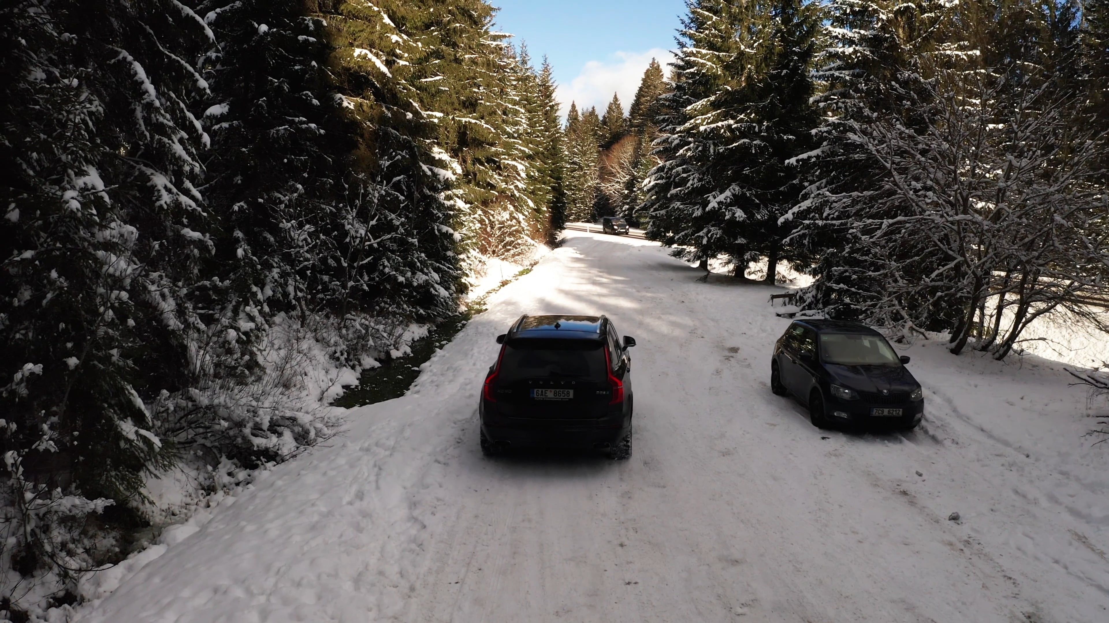 Drone Following a Moving Car in the Snow Covered Road · Free Stock Video