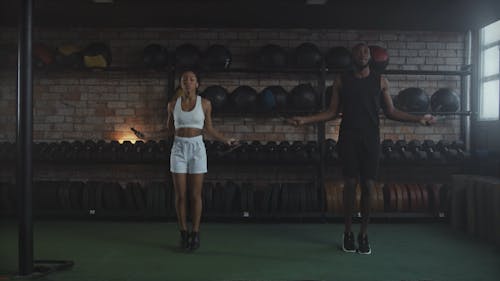 Man and Woman Doing Single Unders