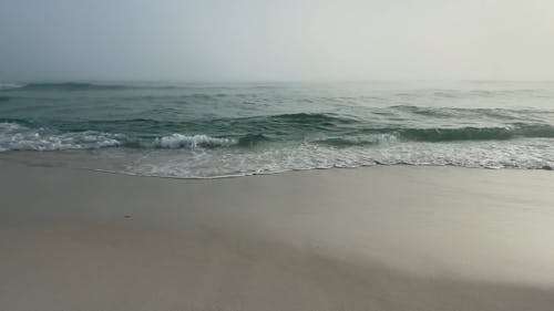 Waves Hitting The Beach Shore