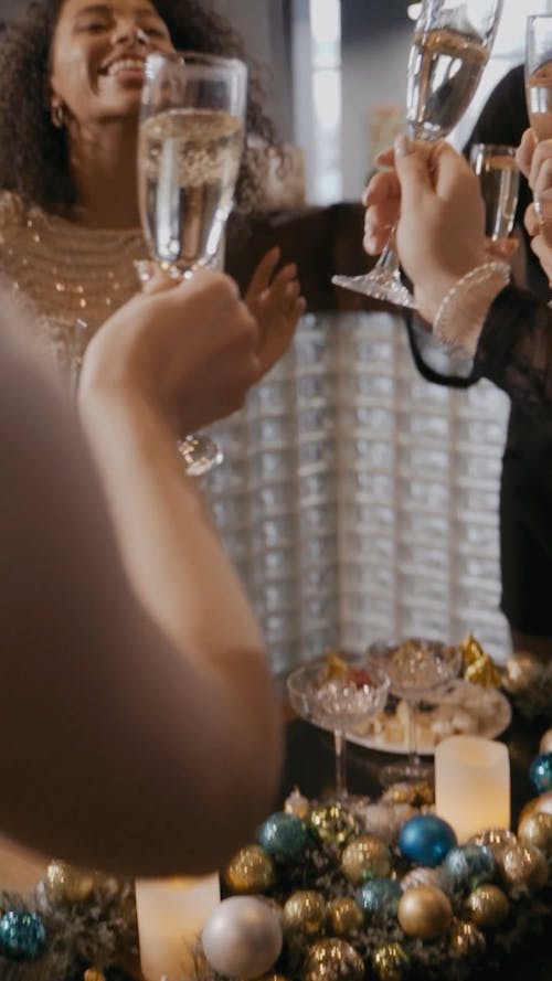 Group of Women Clinking Champagne Glasses