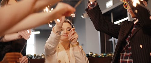 People Holding Sparklers