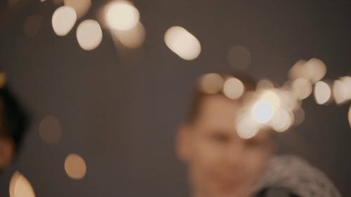 People Holding Sparklers