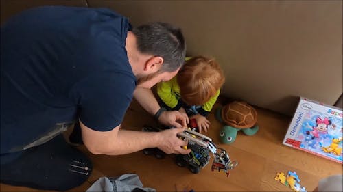 Father and Son Playing on the Floor