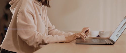 Woman Using a Laptop at Home