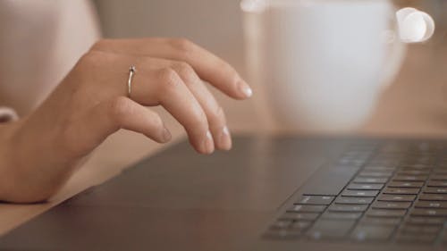 Close Up Shot of a Person Typing on the Laptop