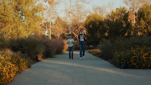 Two Young Boys Walking