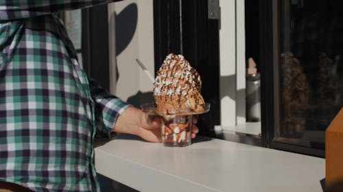 A Person Holding a Ice Cream