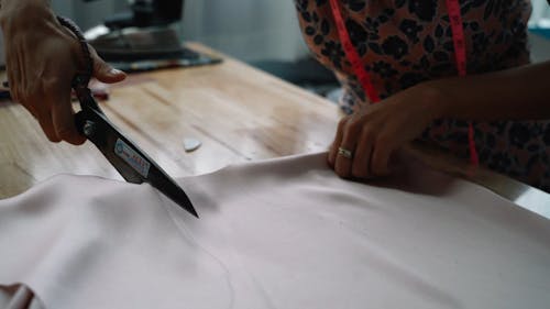 Dressmaker Cutting Fabric Close up