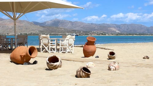 Decorative Vases on a Sandy Beach