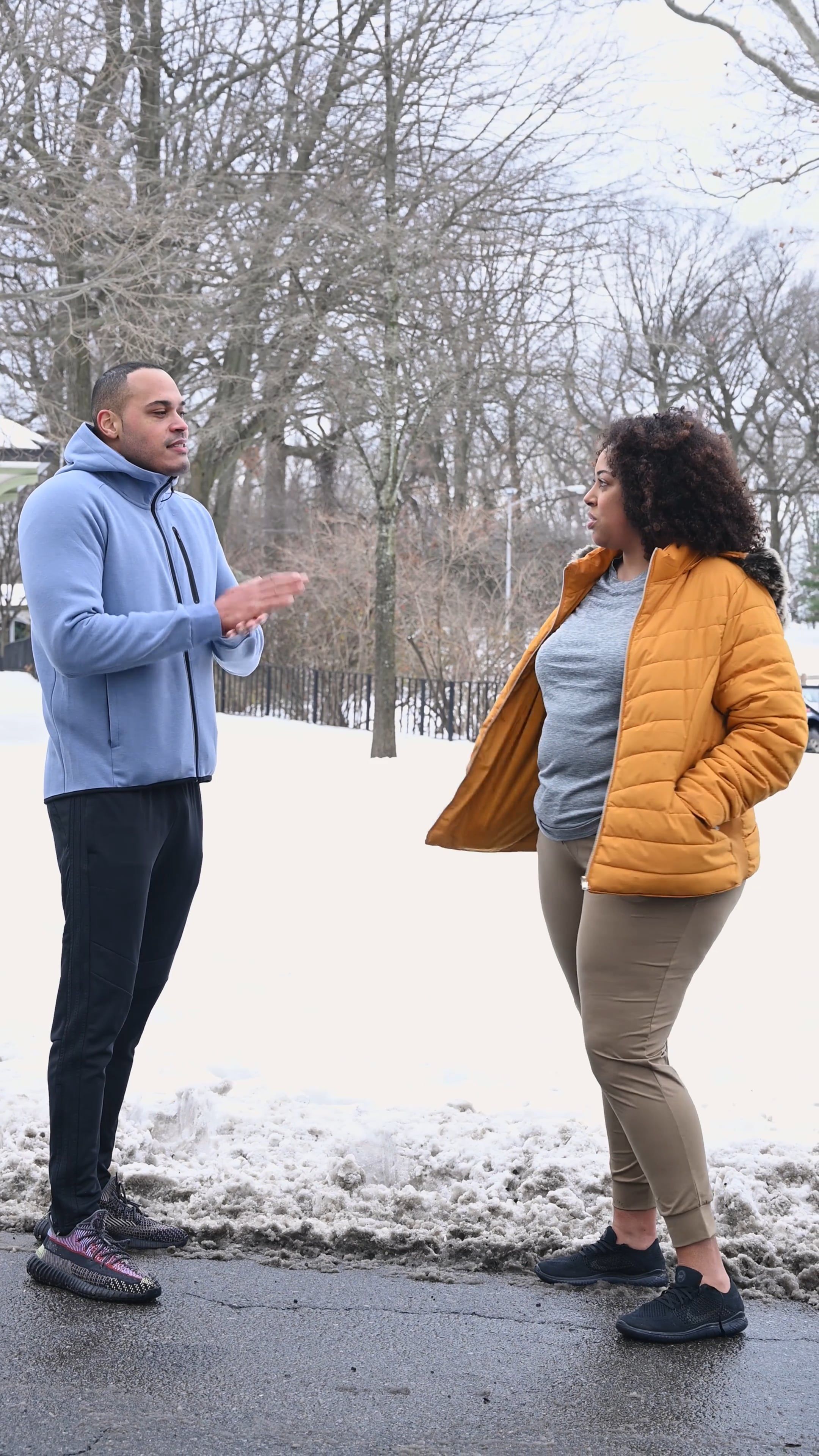 A Man and a Woman Talking in the Street on a Snowy Day Free Stock Video ...