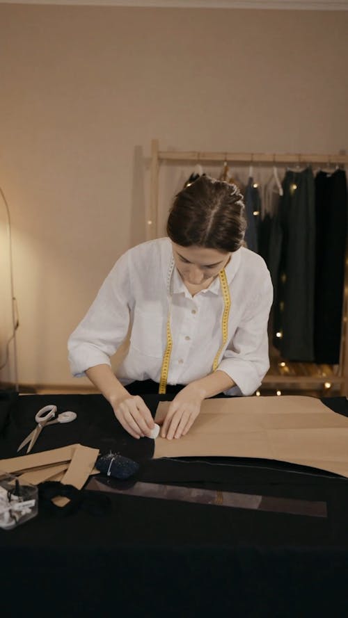 Woman Marking Outline on Fabric