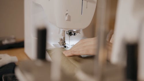 Woman Sewing Cloth with Machine