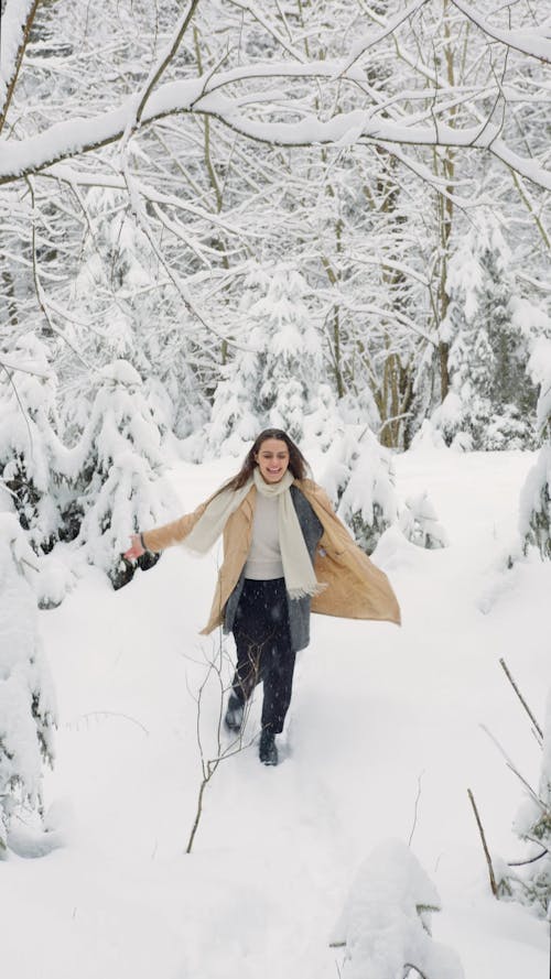 Woman Enjoying the Snowfall