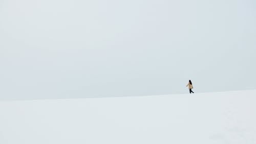 Woman Walking on Snow