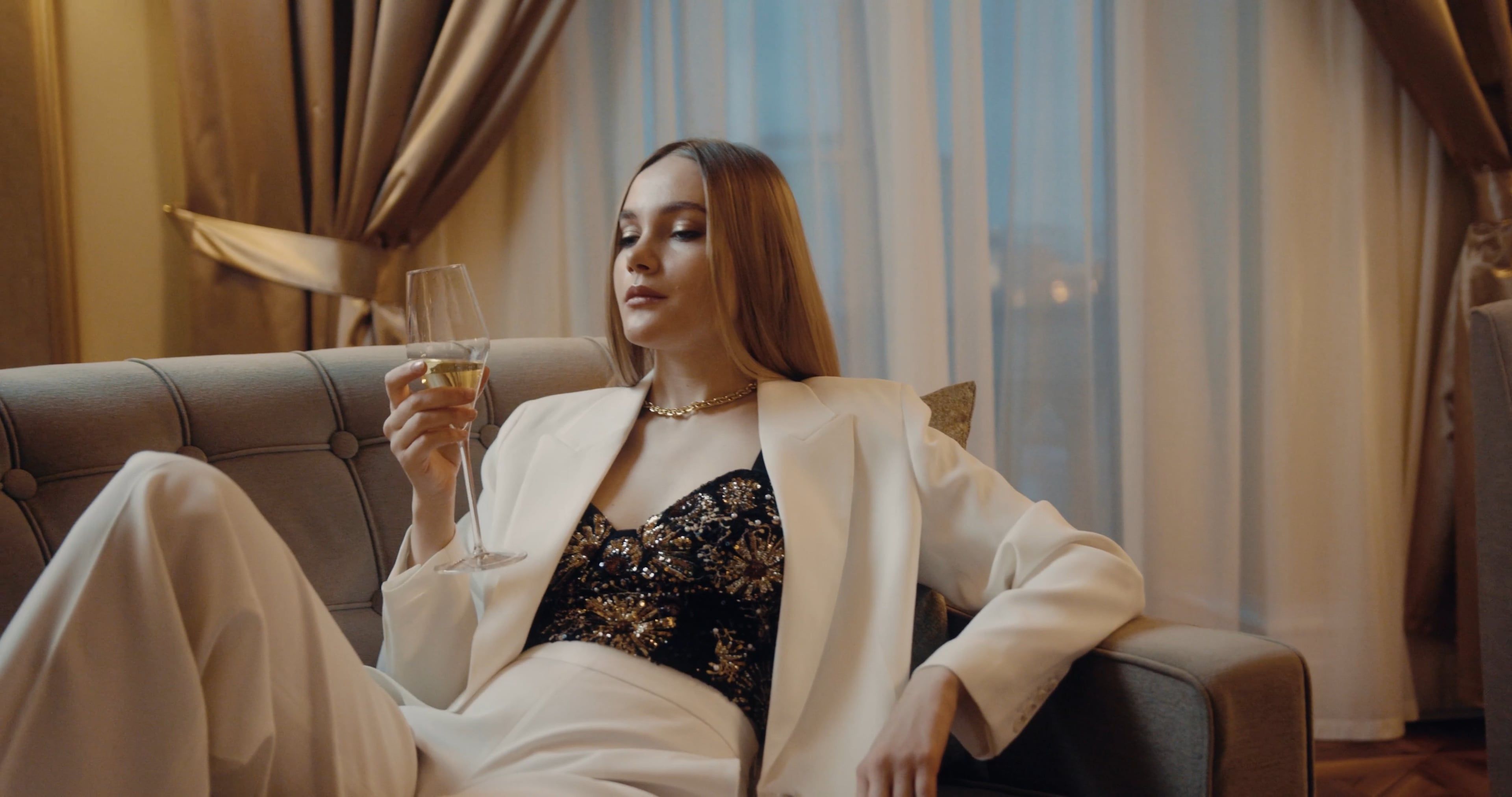 A Woman Drinking an Alcoholic Beverage while Staying in a Hotel Free ...