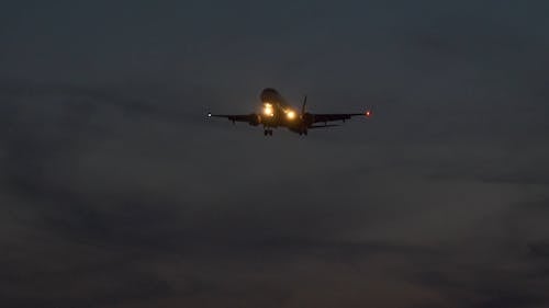 Footage of a Flying Airplane at Night