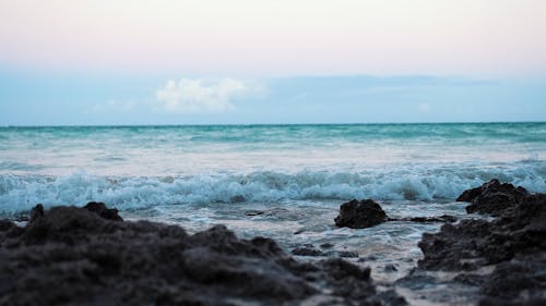 Close-Up Of Waves Breaking In The Rocks